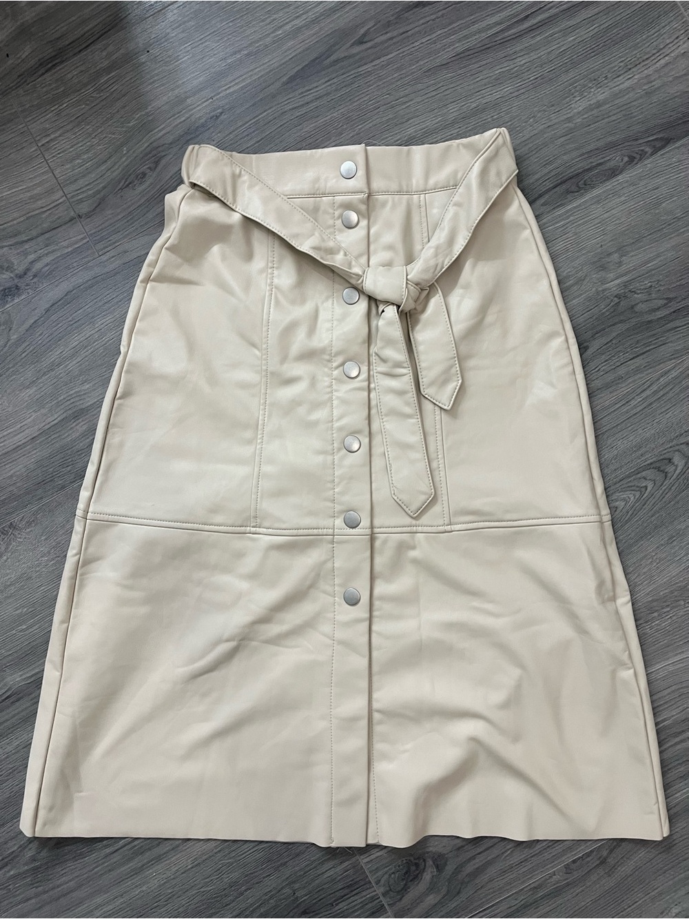 Cream leather midi skirt with button-up front and tie waist, size XS